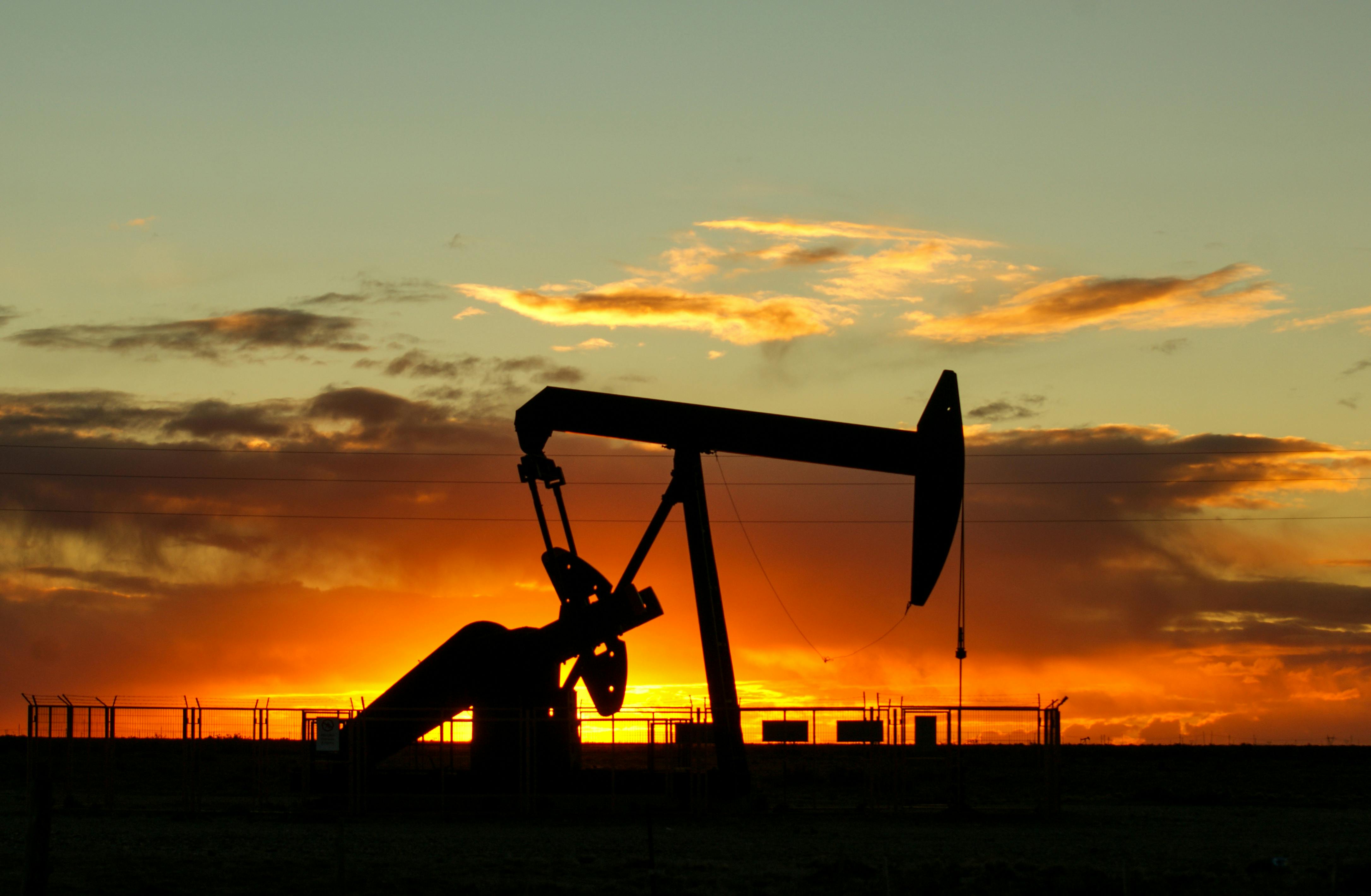 Oil pumpjack at sunset